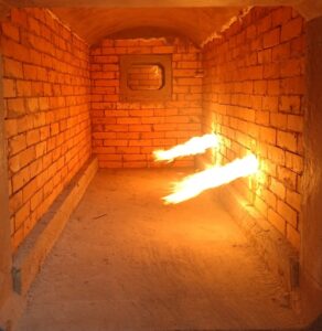 a brick tunnel with fire coming out of it